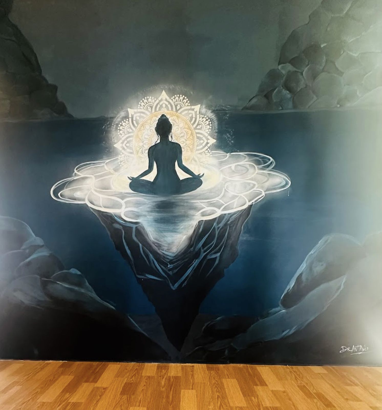 The hand-painted meditation mural in the Manas.Fit studio